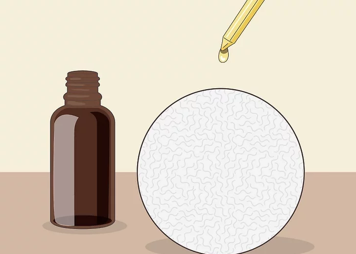 Bước 2: Thêm tinh dầu vào bóng sấy len nếu bạn muốn làm thơm quần áo